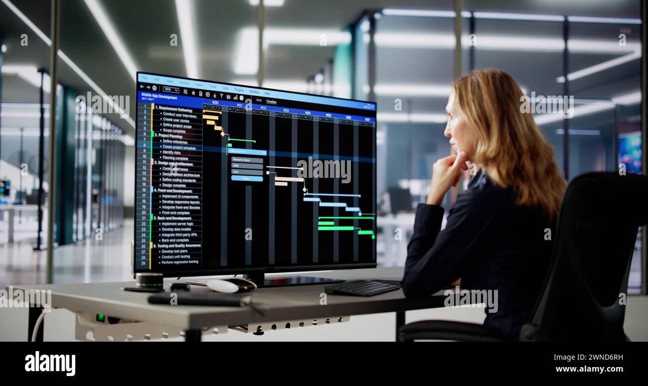 Data Analyst Woman Using Spreadsheet On Computer Stock Photo