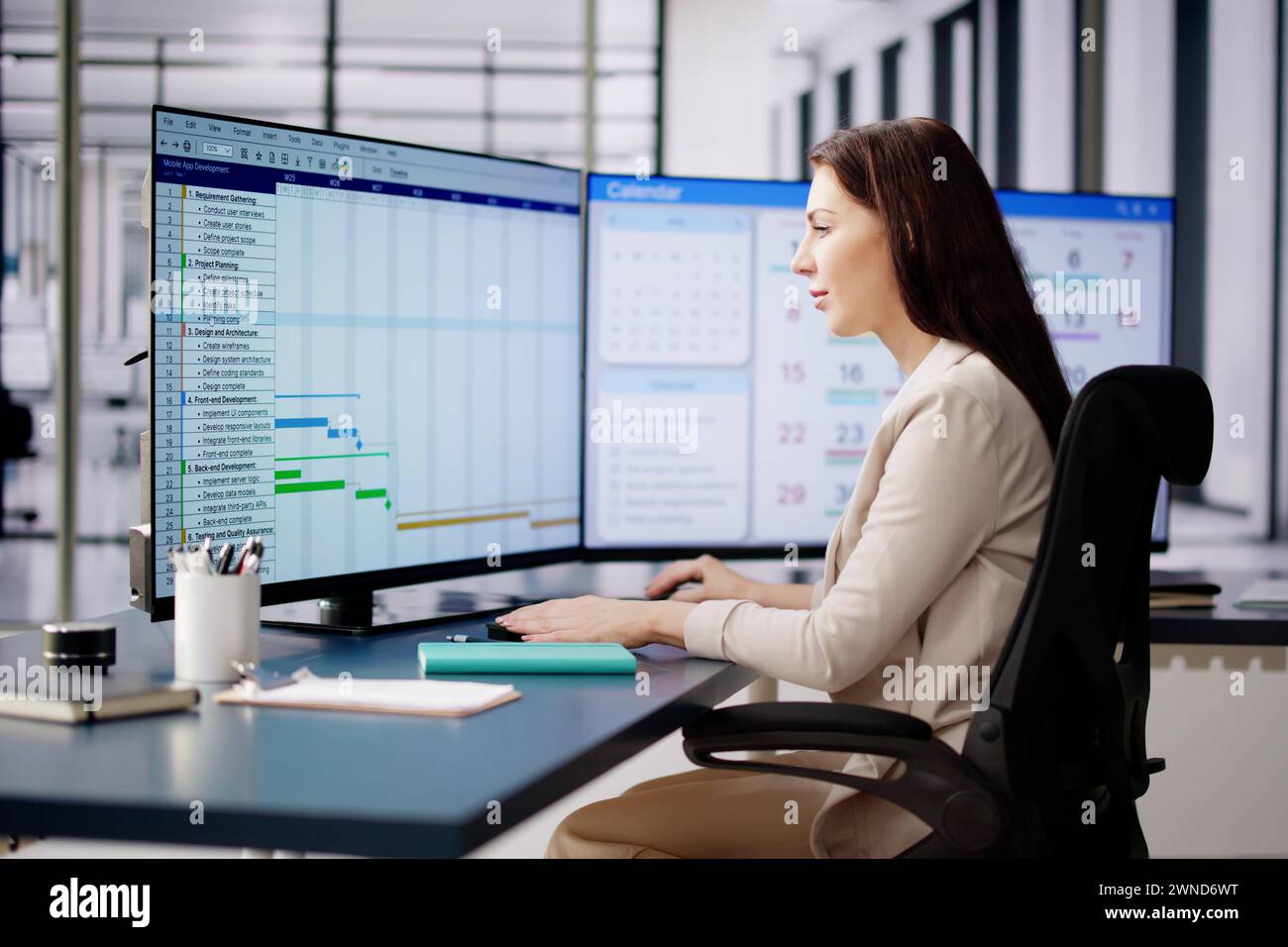 Woman Working On Calendar Agenda Schedule On Computer Stock Photo