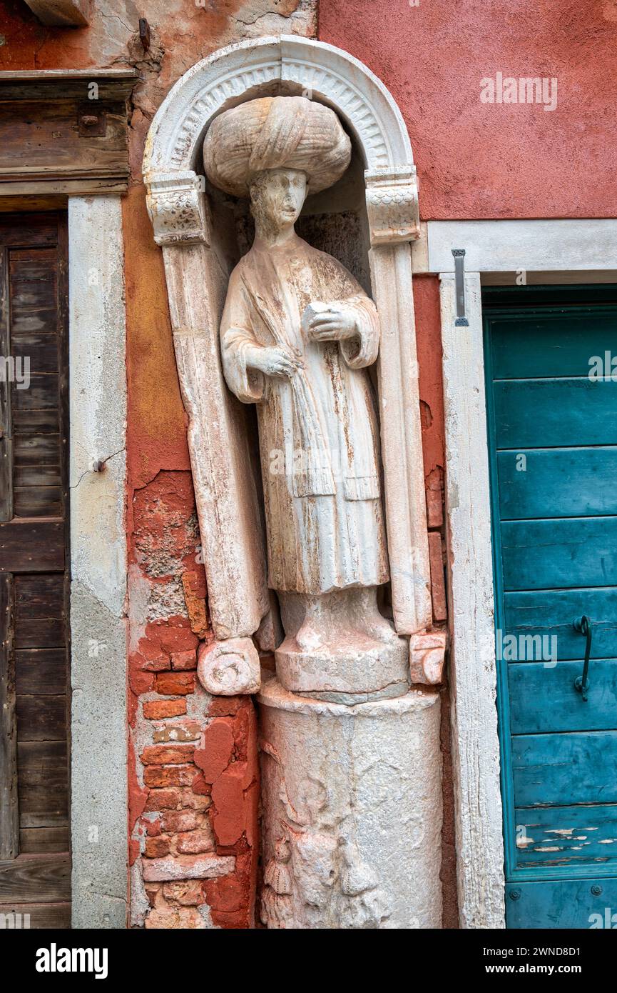 One of three ancient statues located at Campo dei Mori in Venice Stock Photo