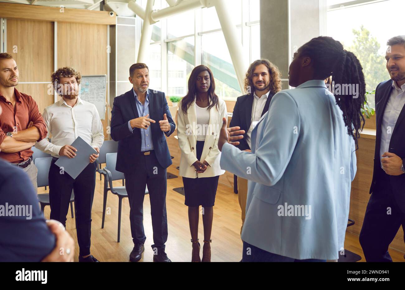 Team of business people discussing mistakes and problems during work meeting in office Stock Photo