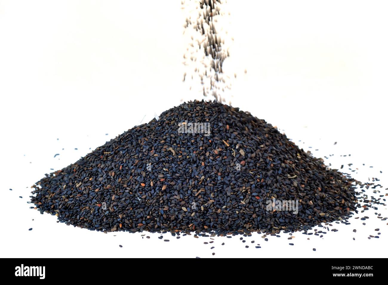 Black sesame seeds on a white background Stock Photo Alamy