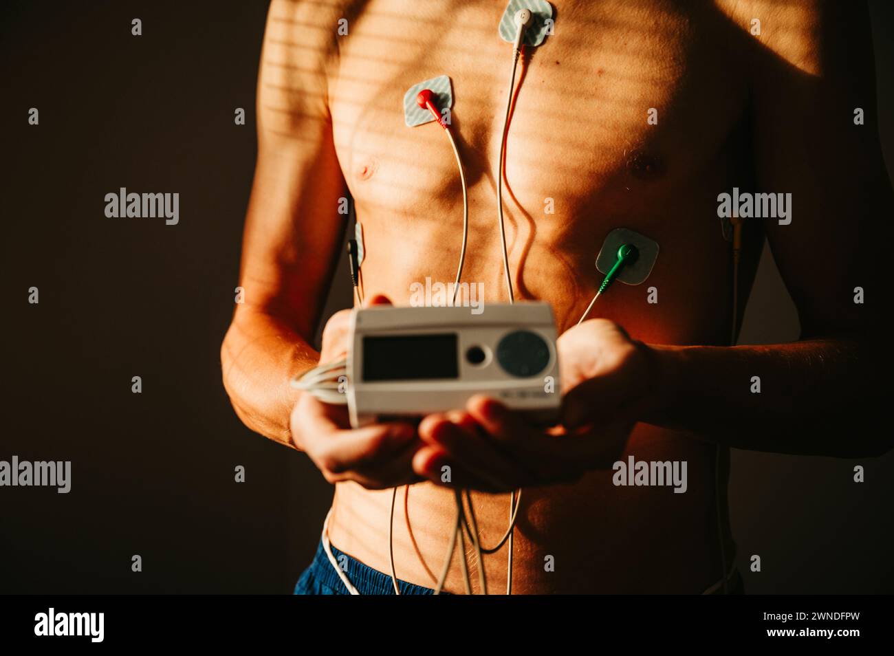 Vital Signs in Focus: Young Man Monitored by EKG for Comprehensive