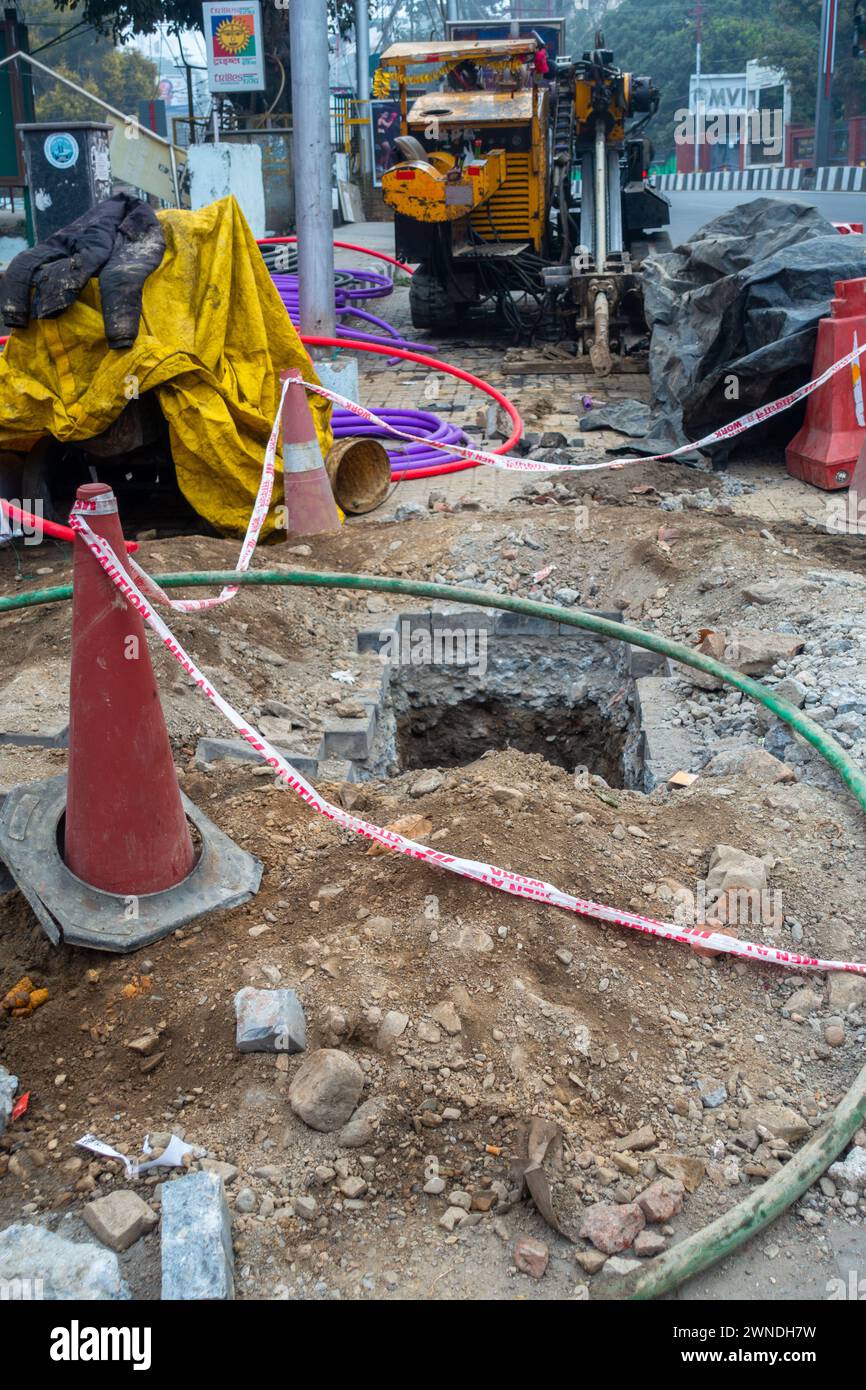 Jan.11th 2024, Uttarakhand India. Urban Infrastructure Development: Roadside Digging for Underground Wiring, Rajpur Road, Dehradun, Uttarakhand, India Stock Photo