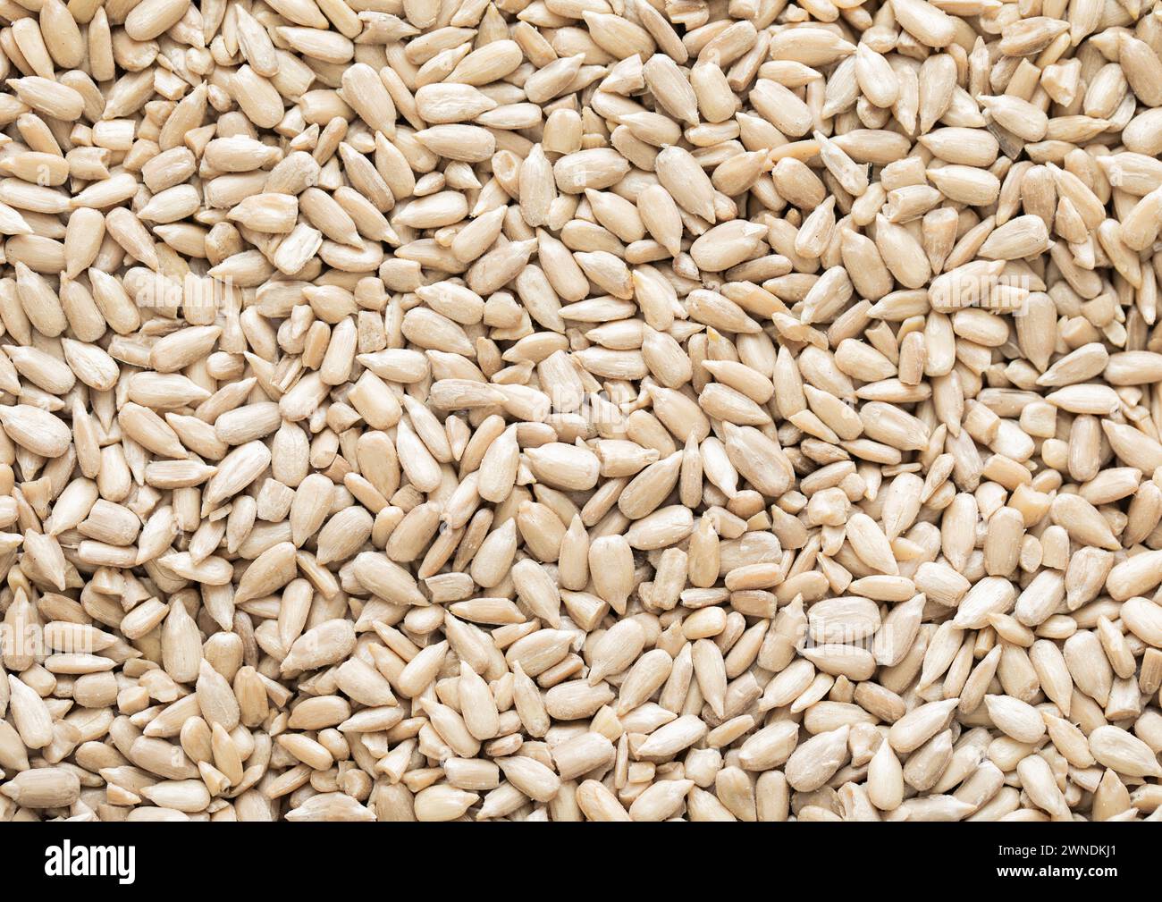 Healthy peeled sunflower seeds top view macro background Stock Photo ...