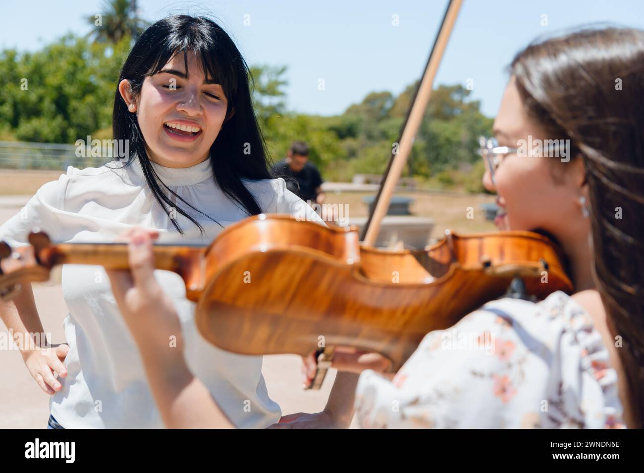 group of young latin women artist singer and violinist busker, on ...
