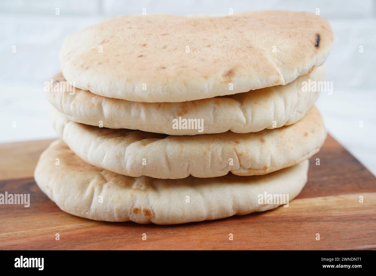 A stack of Pita bread(flat bread) on wooden board Stock Photo