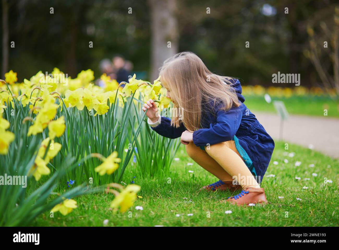 Springtime Kids Outside Adorable preschooler girl enjoying nice spring day in park during ...