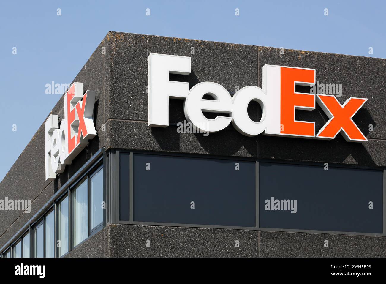 Kolding, Denmark - August 16, 2020: FedEx sign on a building. FedEx Corporation is an American global courier delivery services company Stock Photo
