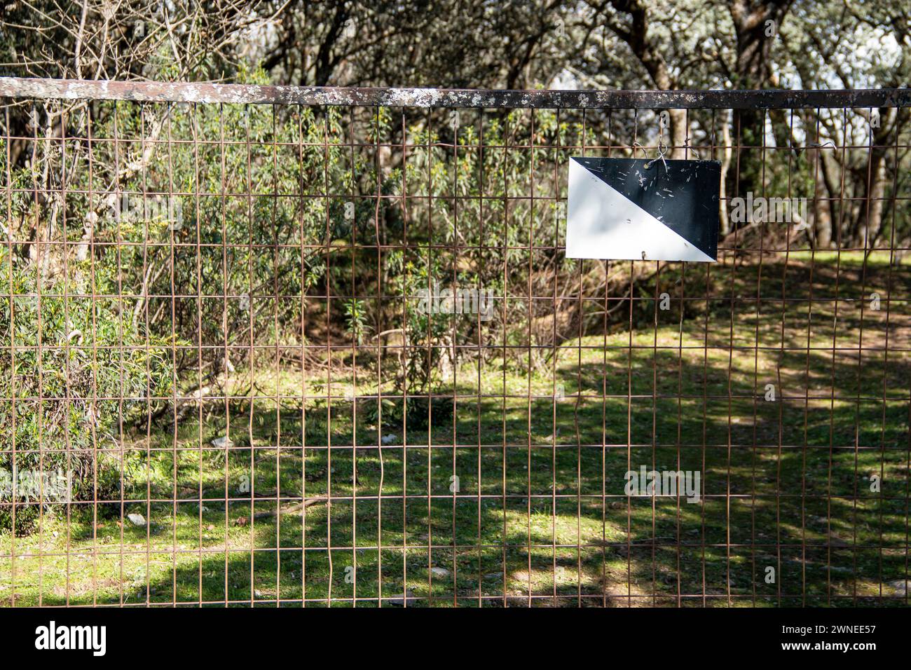 'Private hunting reserve' sign on a country property where it is delimited by metal fences Stock Photo