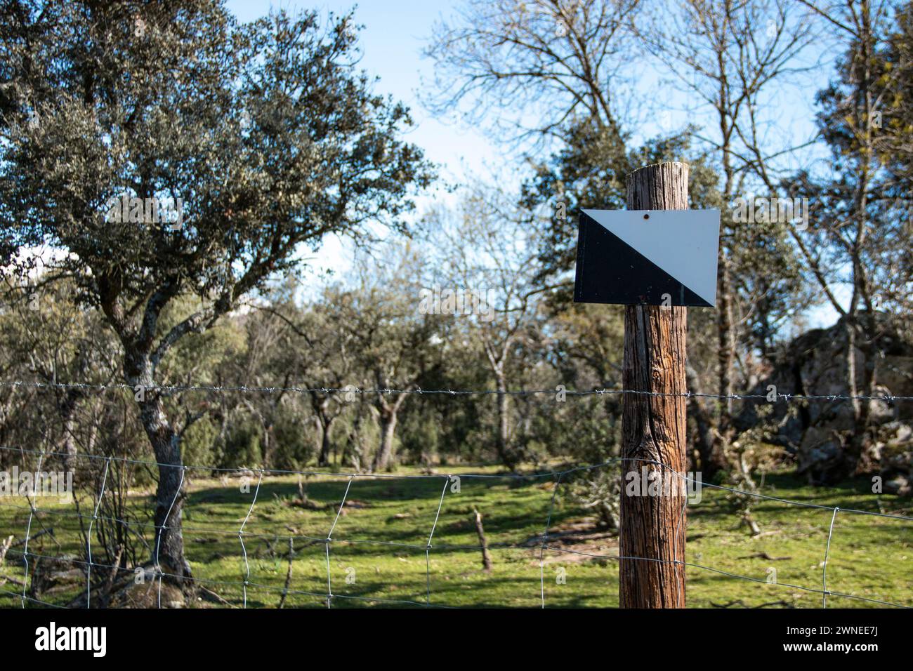 'Private hunting reserve' sign on a country property where it is delimited by metal fences Stock Photo