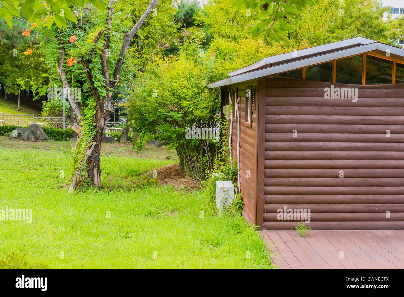 Side view of public restrooms in log cabin architecture in beautiful