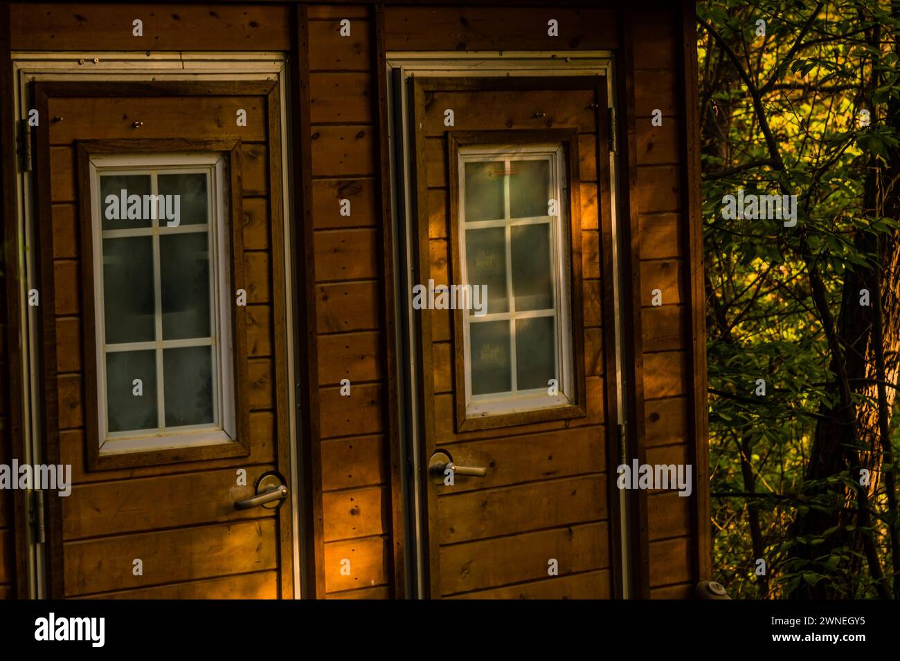 Closeup of wooden public toilets in a woodland park area in South Korea in South Korea Stock Photo