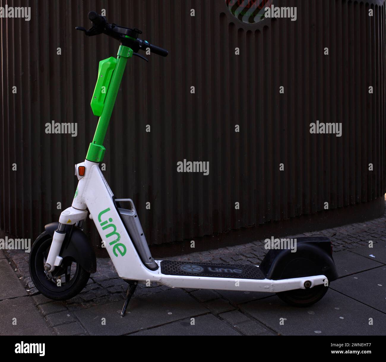 Electric scooter parked on the side of the road at the bike rental company Lime, OnLime and Uber, Stuttgart, Baden-Wuerttemberg, Germany Stock Photo
