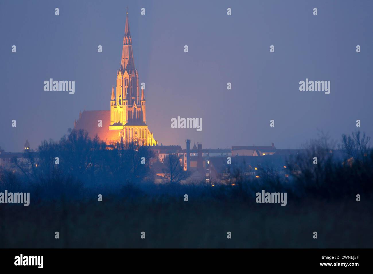 Illuminated cathedral in the Hanseatic town of Demmin on the River Peene, Peene Valley River Landscape nature park Park, Mecklenburg-Western Stock Photo