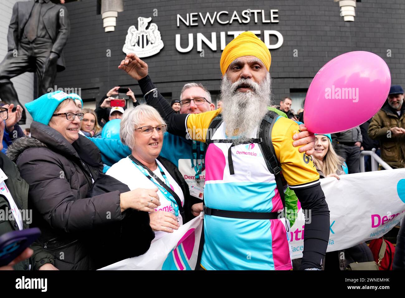 Manny Singh Kang celebrates after completing a 195 mile walk from Wolverhampton to Newcastle for the charity Dementia UK before the Premier League match at St. James' Park, Newcastle upon Tyne. Picture date: Saturday March 2, 2024. Stock Photo