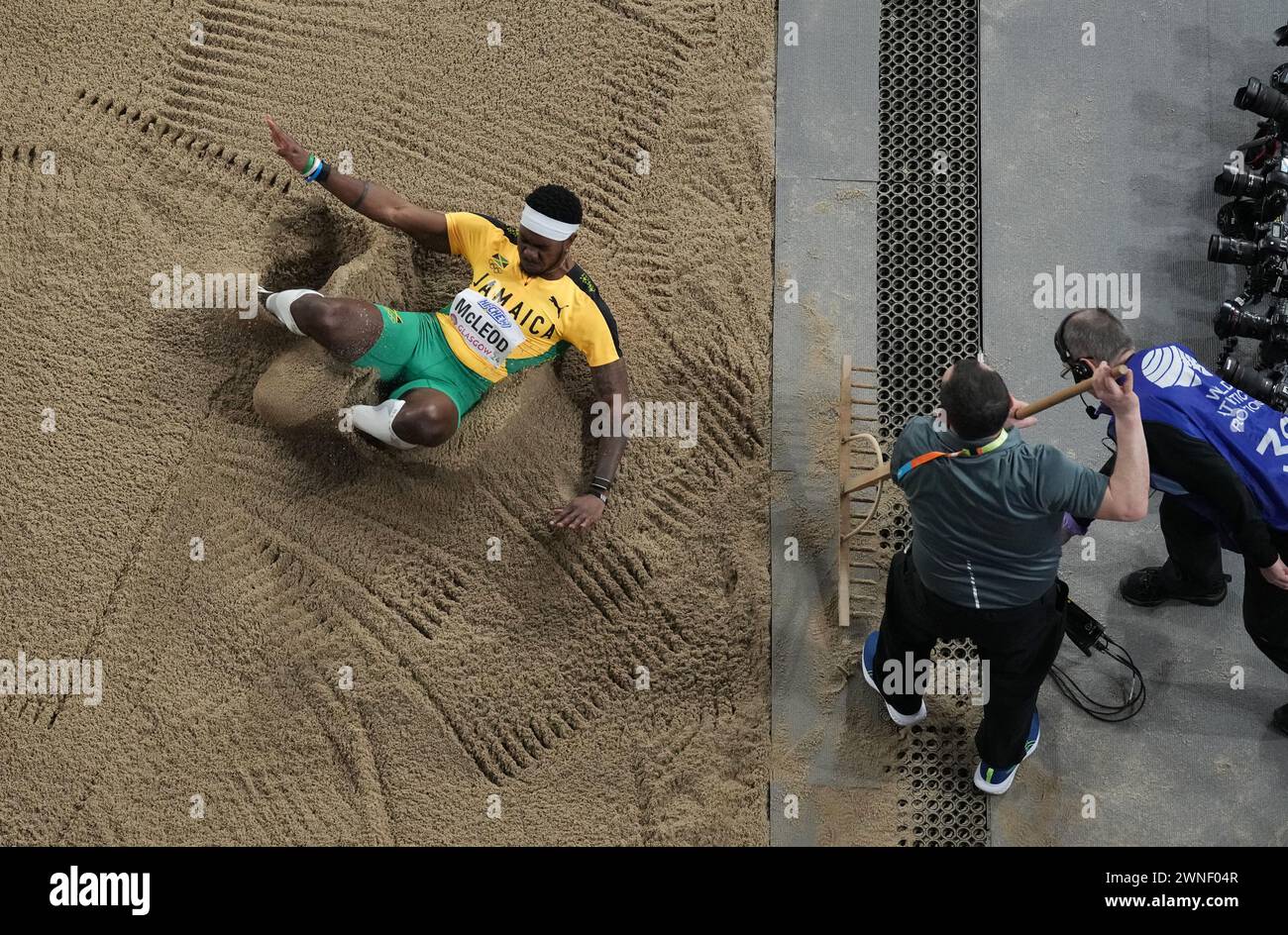 Jamaica's Carey Mcleod Lands In The Pit As Staff Rake The Sand During ...