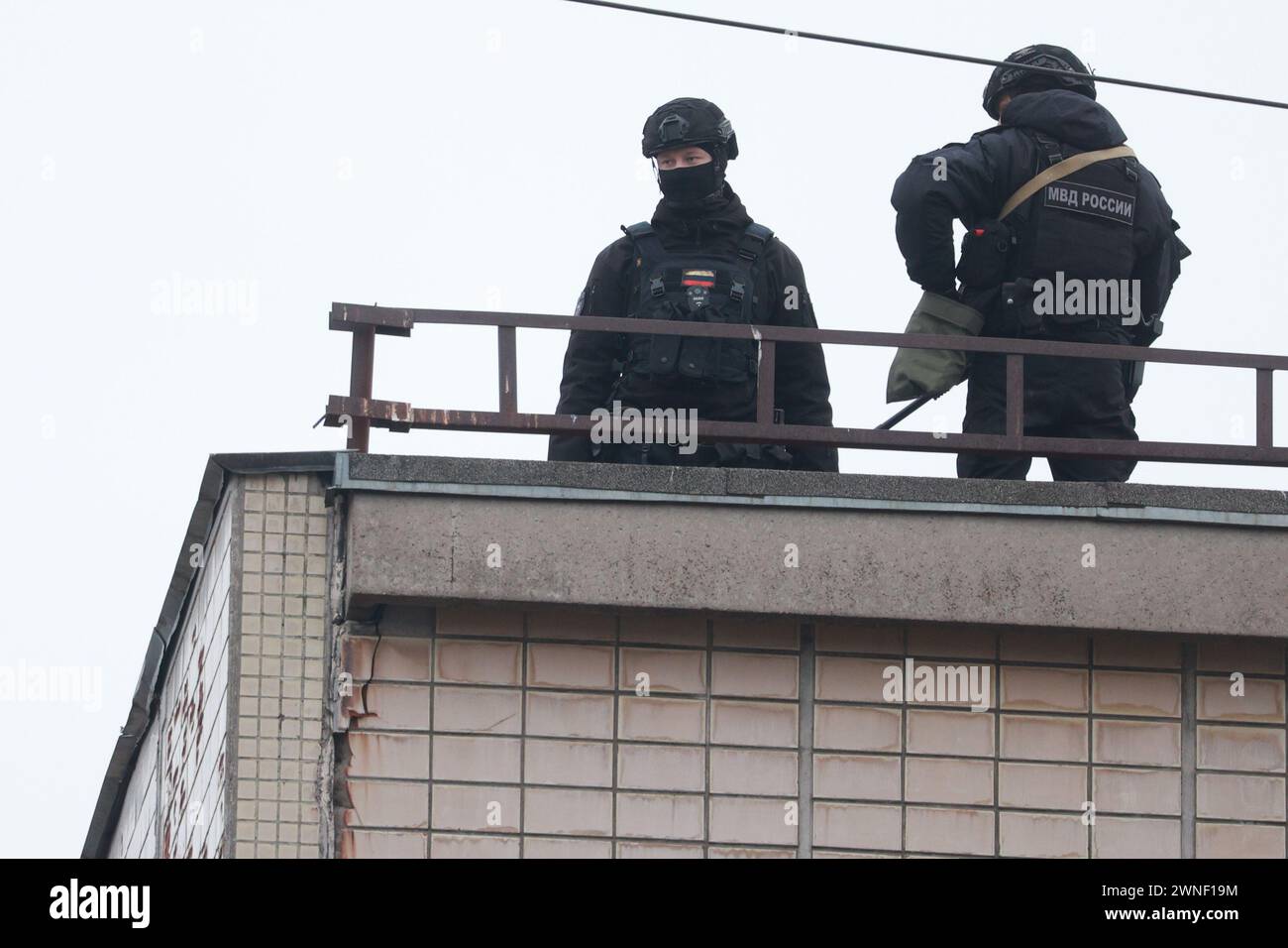 Saint Petersburg, Russia. 02nd Mar, 2024. Policemen seen on top of the building around a damaged residential building after an alleged drone attack, which was reported by local media at Krasnogvardeisky district. The Russian Ministry of Emergency Situations take security measures around the building. Credit: SOPA Images Limited/Alamy Live News Stock Photo