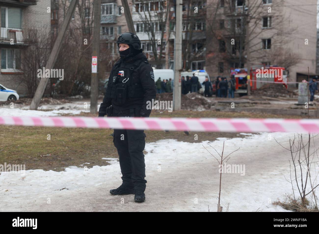 Saint Petersburg, Russia. 02nd Mar, 2024. A policeman is seen around a damaged residential building after an alleged drone attack, which was reported by local media at Krasnogvardeisky district. The Russian Ministry of Emergency Situations take security measures around the building. Credit: SOPA Images Limited/Alamy Live News Stock Photo