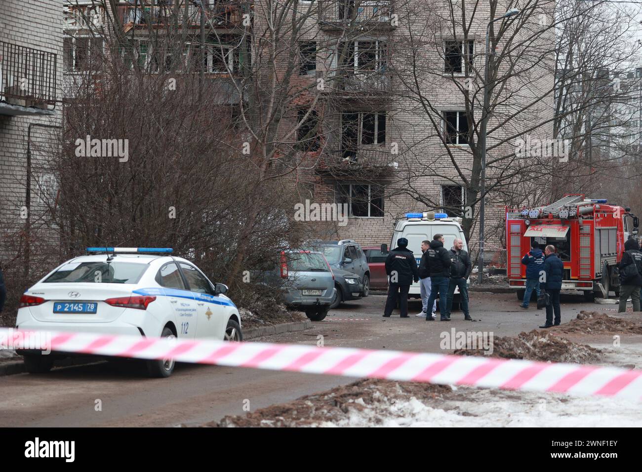 Saint Petersburg, Russia. 02nd Mar, 2024. Policemen seen around a damaged residential building after an alleged drone attack, which was reported by local media at Krasnogvardeisky district. The Russian Ministry of Emergency Situations take security measures around the building. Credit: SOPA Images Limited/Alamy Live News Stock Photo