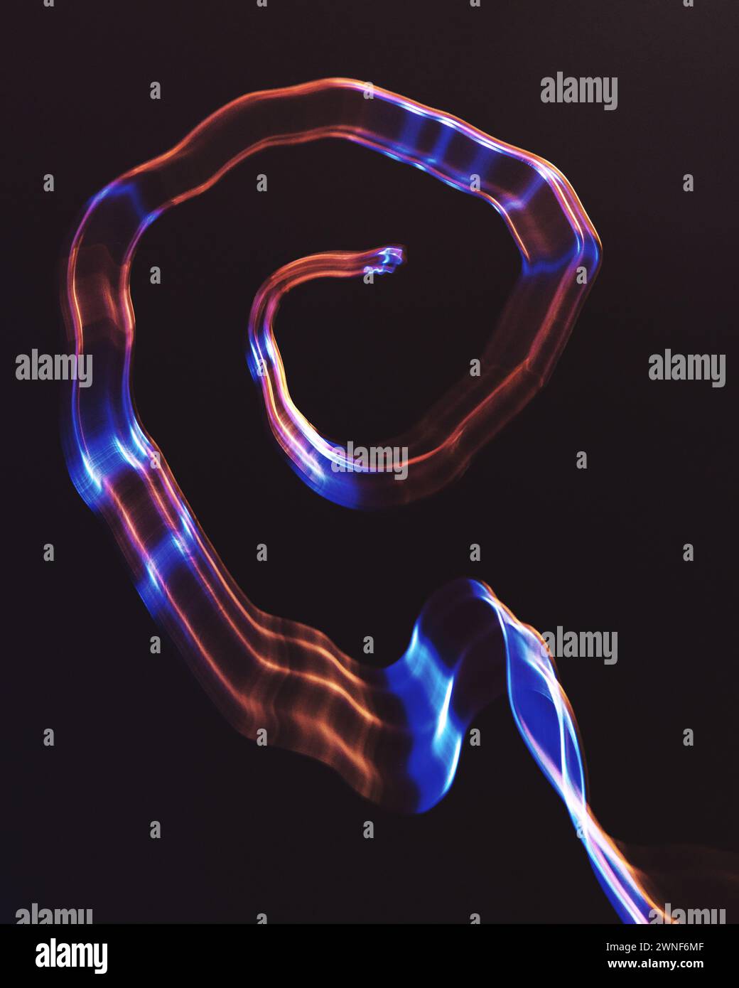 Abstract shaped created using copper wire and intentional camera movement Stock Photo