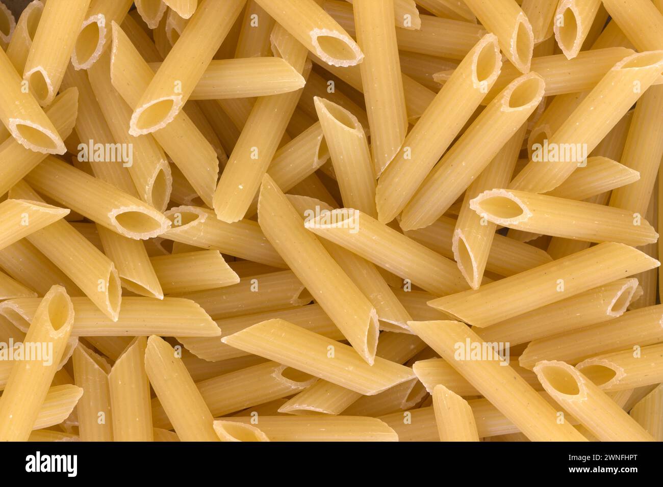 The Italian Pasta Penne. Closeup View From Above For Solid Background Usage. Stock Photo