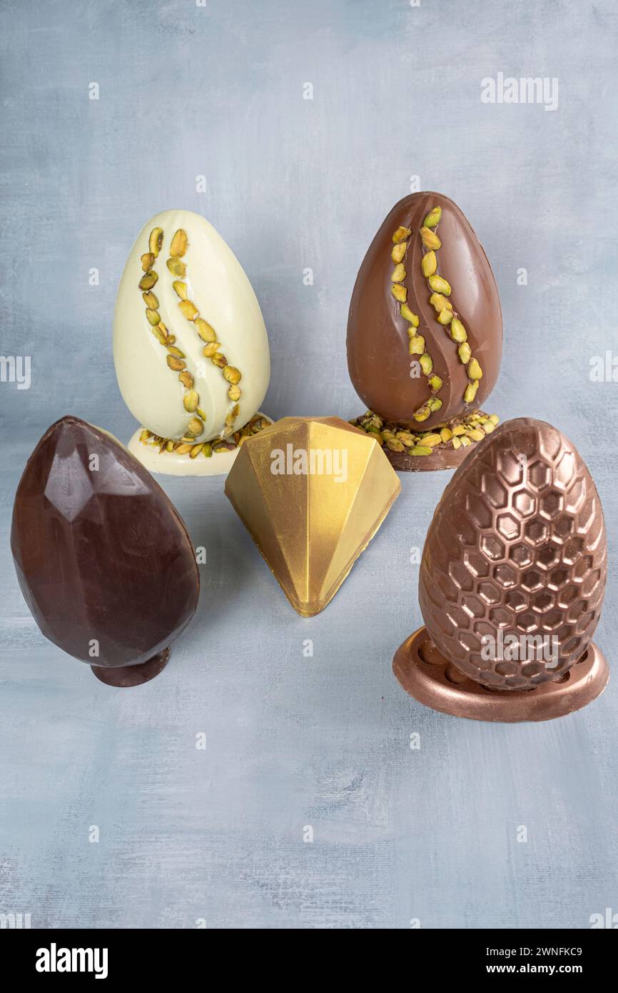 Assorted Easter eggs with pistachios, milk and dark chocolate_2. Stock Photo
