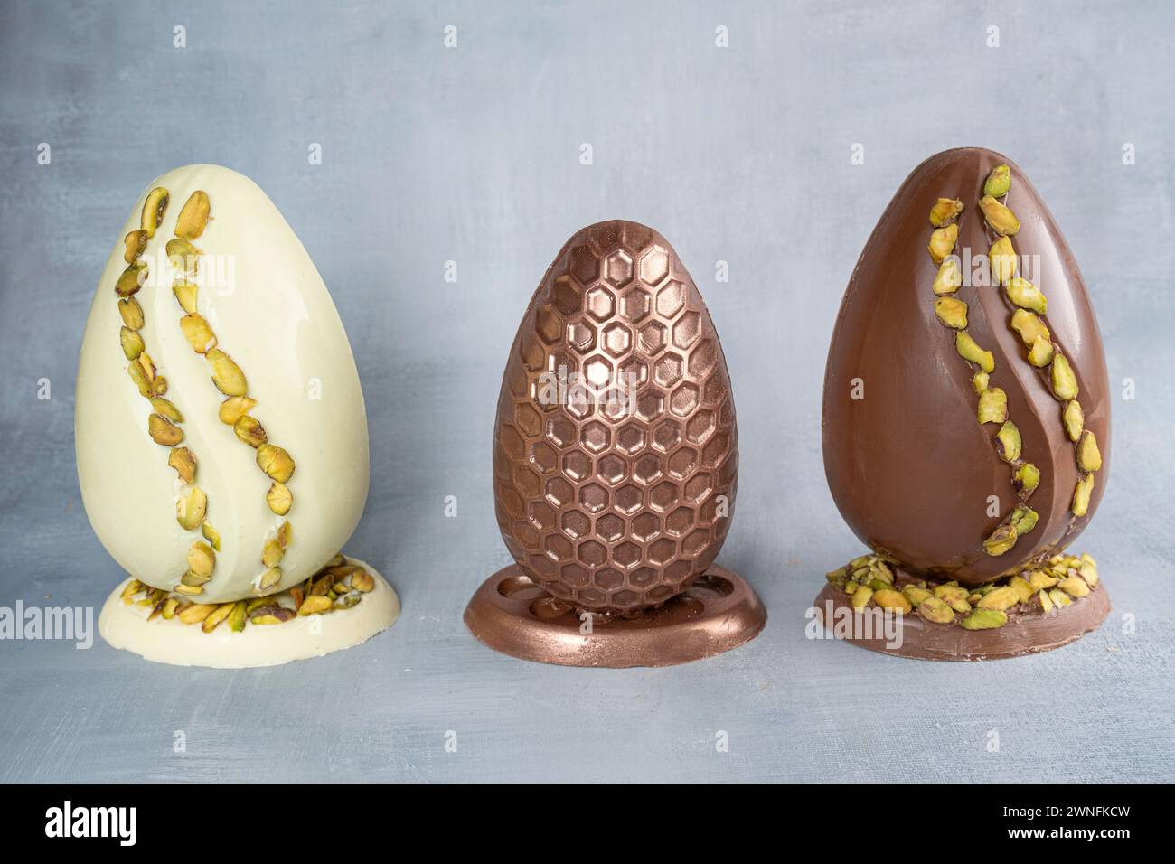 Assorted Easter eggs with pistachios, milk and dark chocolate_3. Stock Photo