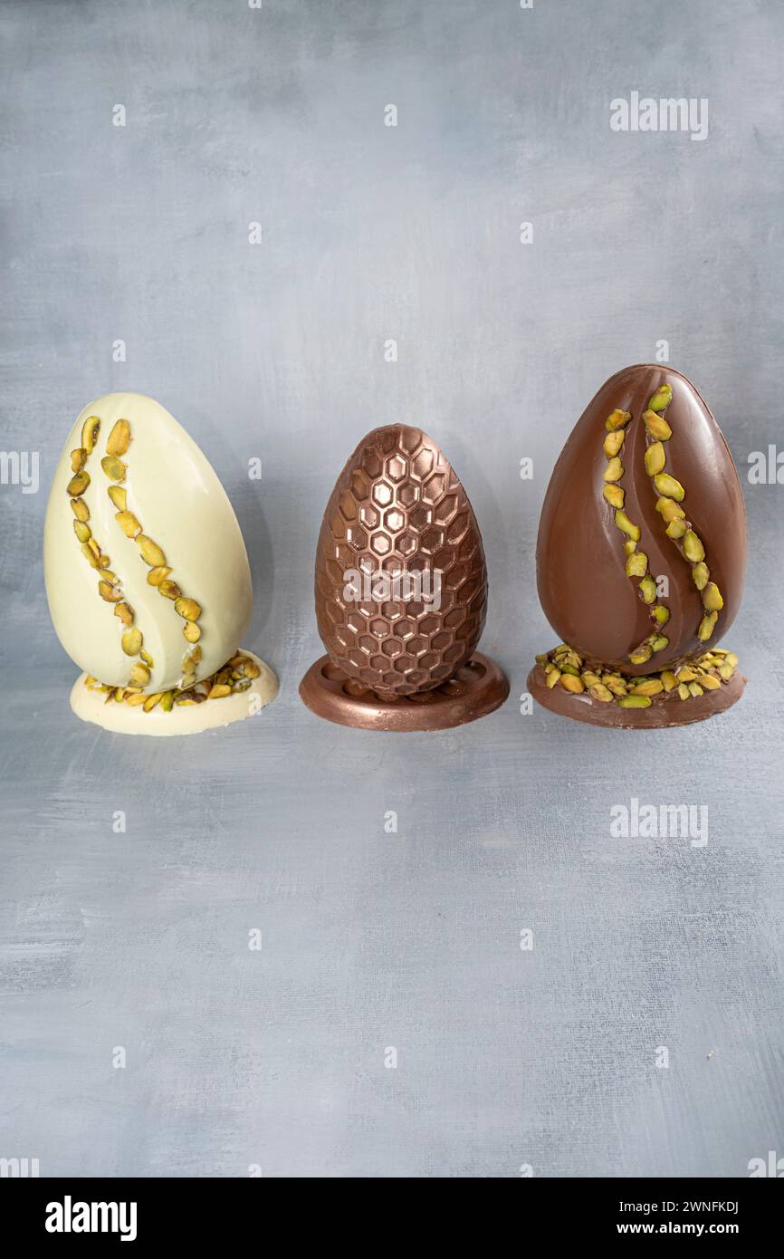 Assorted Easter eggs with pistachios, milk and dark chocolate_5. Stock Photo