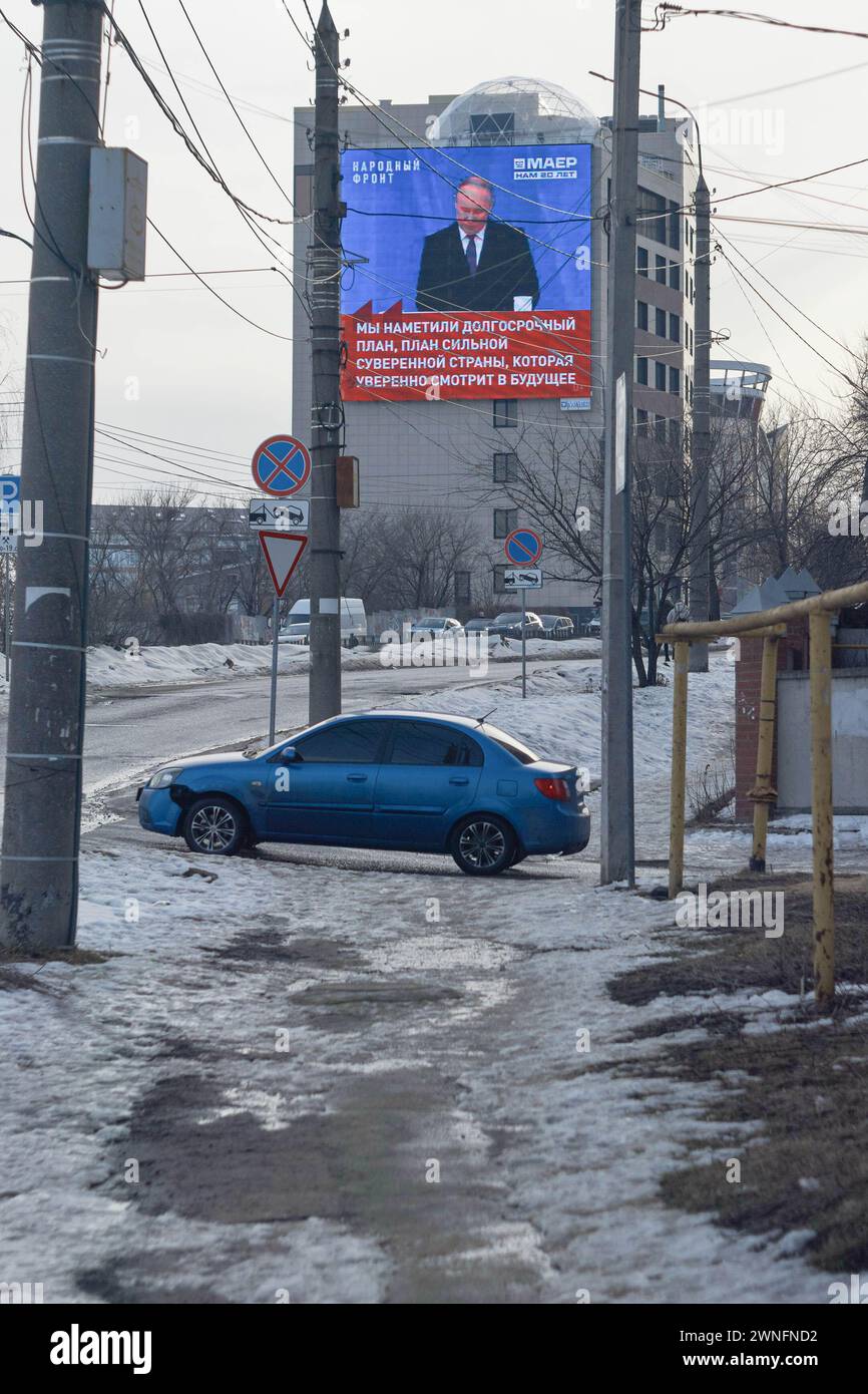 Voronezh, Russia. 29th Feb, 2024. Broadcast of President Vladimir Putin's speech on the city scoreboard in the area of the Pedagogical Institute. At the end of February - beginning of March, spring warmth came to the million-plus city of Central Russia, Voronezh. Slush and puddles did not prevent Voronezh residents from seeing election campaign signs on street boards. The presidential elections in the Russian Federation are scheduled for March 17. Four candidates are participating in the elections, three of whom fully support the policies of the current president, Vladimir Putin. And the fo Stock Photo