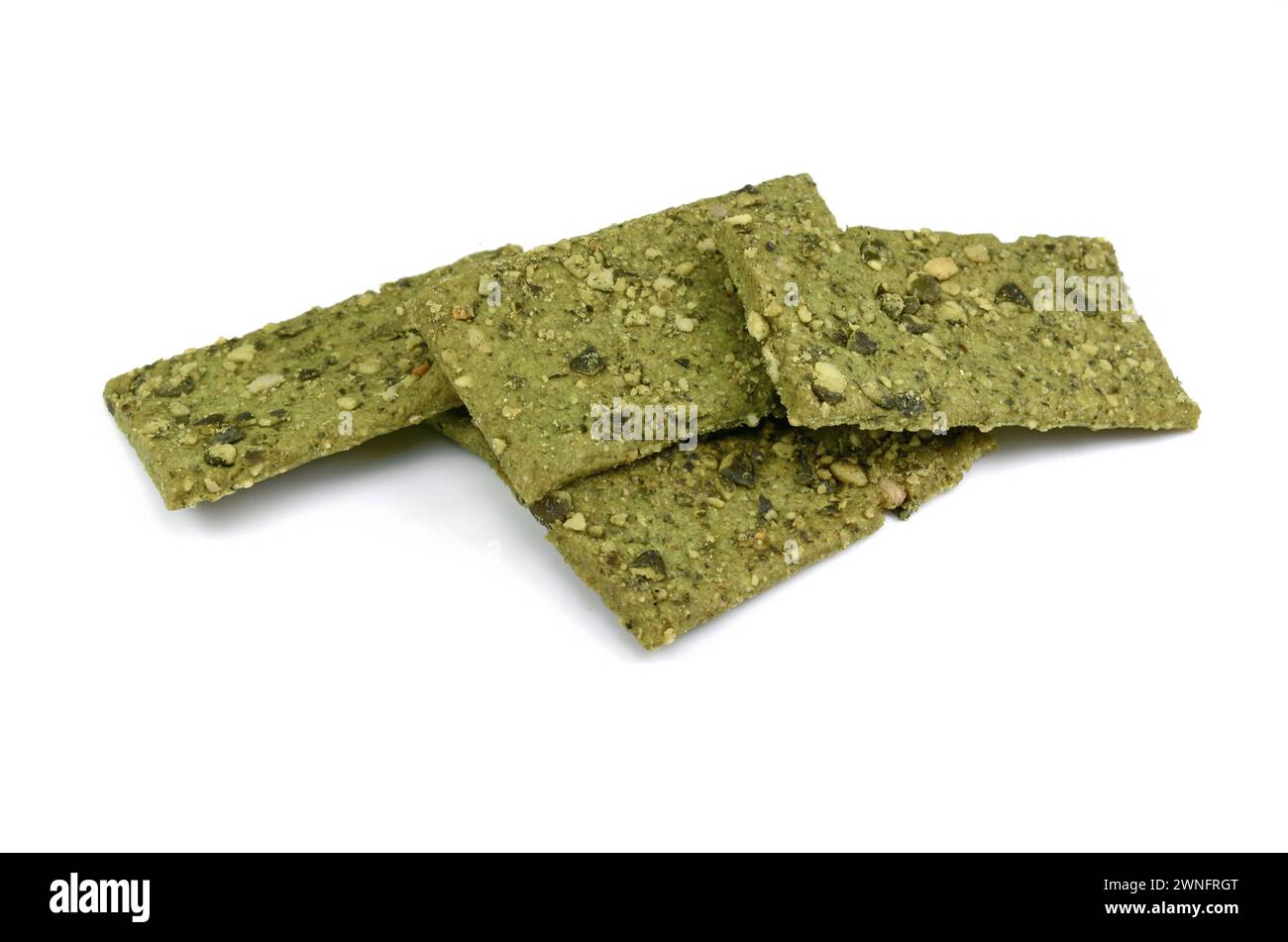 Green Healthy snack: cereal crunchy multigrain cereal flax seed pumpkin, coriander, sunflower seeds protein bread bar. Protein albumen source. Stock Photo