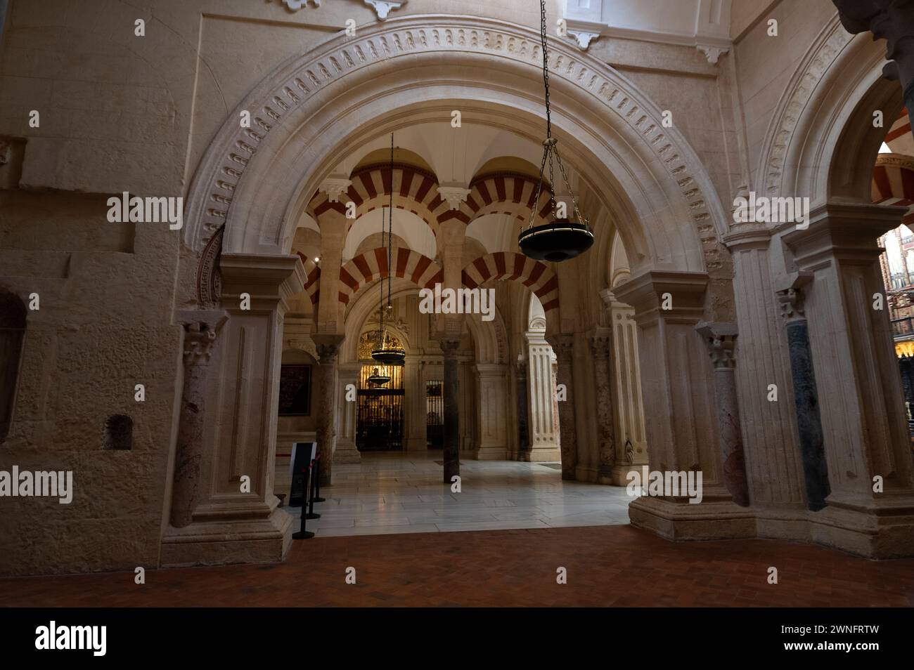 Mosque/ Cathedral of Cordoba  Interior and high ceilings supporting a huge roof by 853 thick marble columns and semi-circle made arches produced of ja Stock Photo