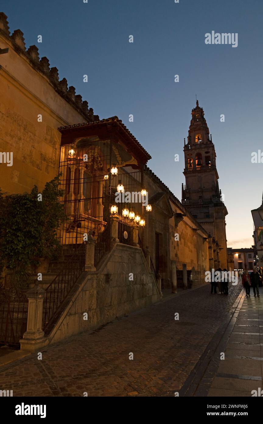 At dusk is the silhouette Bell tower, part of the Mosque/Cathedral in Cordoba in Andalusia, southern Spain.   The bell tower on the site of the former Stock Photo