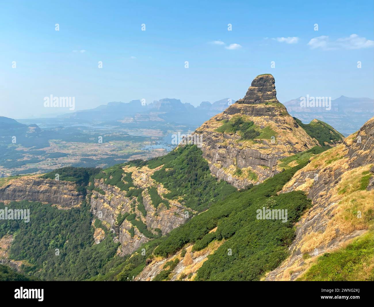 View of the mountain ranges while climbing up Ratangad Fort near Bhandardara in Ahmadnagar district of Maharashtra, India Stock Photo