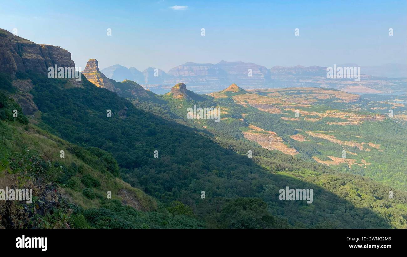 View of the mountain ranges while climbing up Ratangad Fort near Bhandardara in Ahmadnagar district of Maharashtra, India Stock Photo