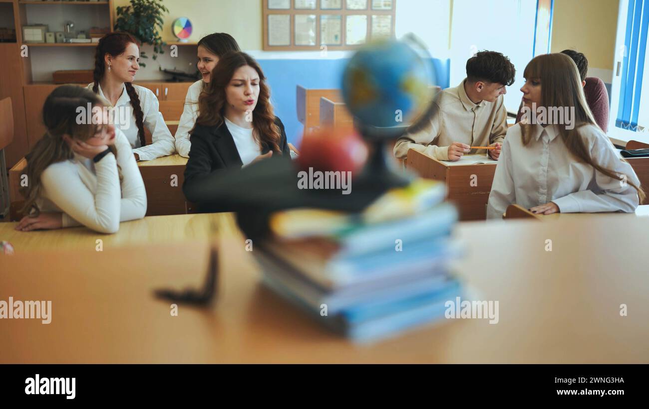 A globe of the world in a school classroom during a lesson in front of ...