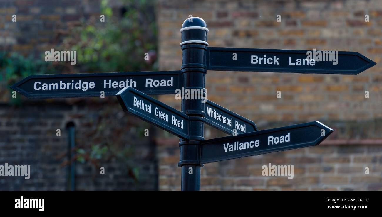 LONDON, UK - MARCH 20, 2011:  Signpost with directions to famous locations in the East end of London including Brick Lane and Bethnal Green Stock Photo