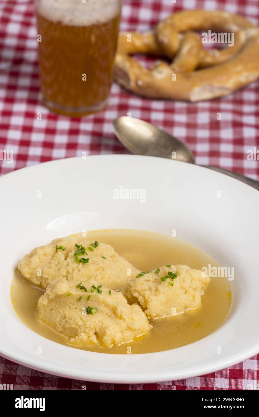 Bavarian Dumpling Soup On Tablecloth Stock Photo