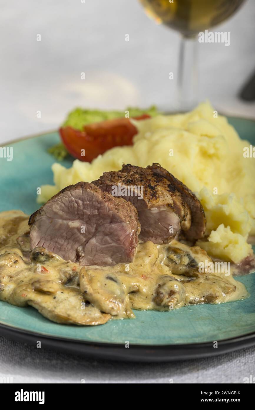 Schweinefilet mit champignon sahnesauce hi-res stock photography and ...