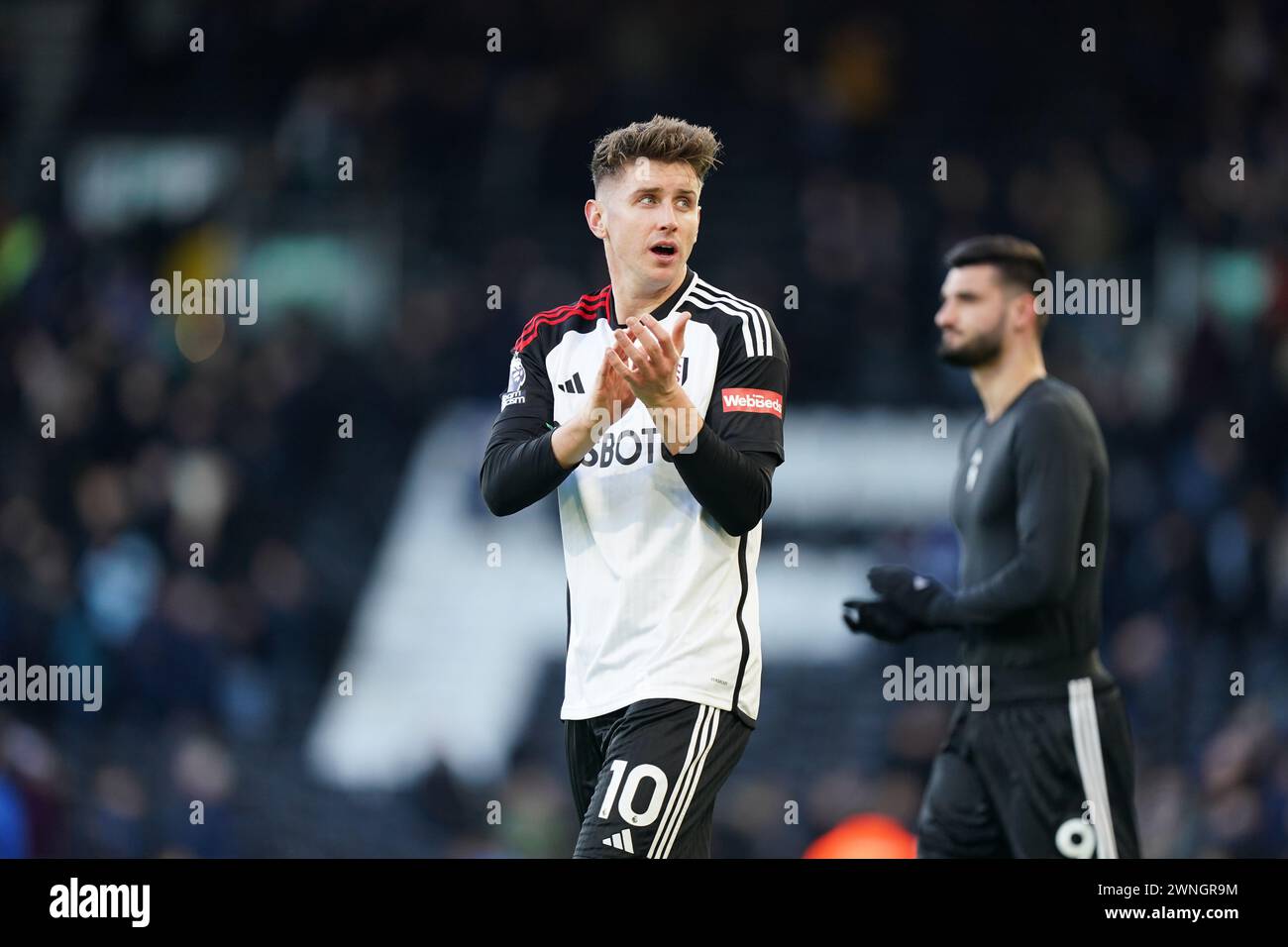 LONDON, ENGLAND - MARCH 02: Tom Cairney of Fulham clapping the fans ...