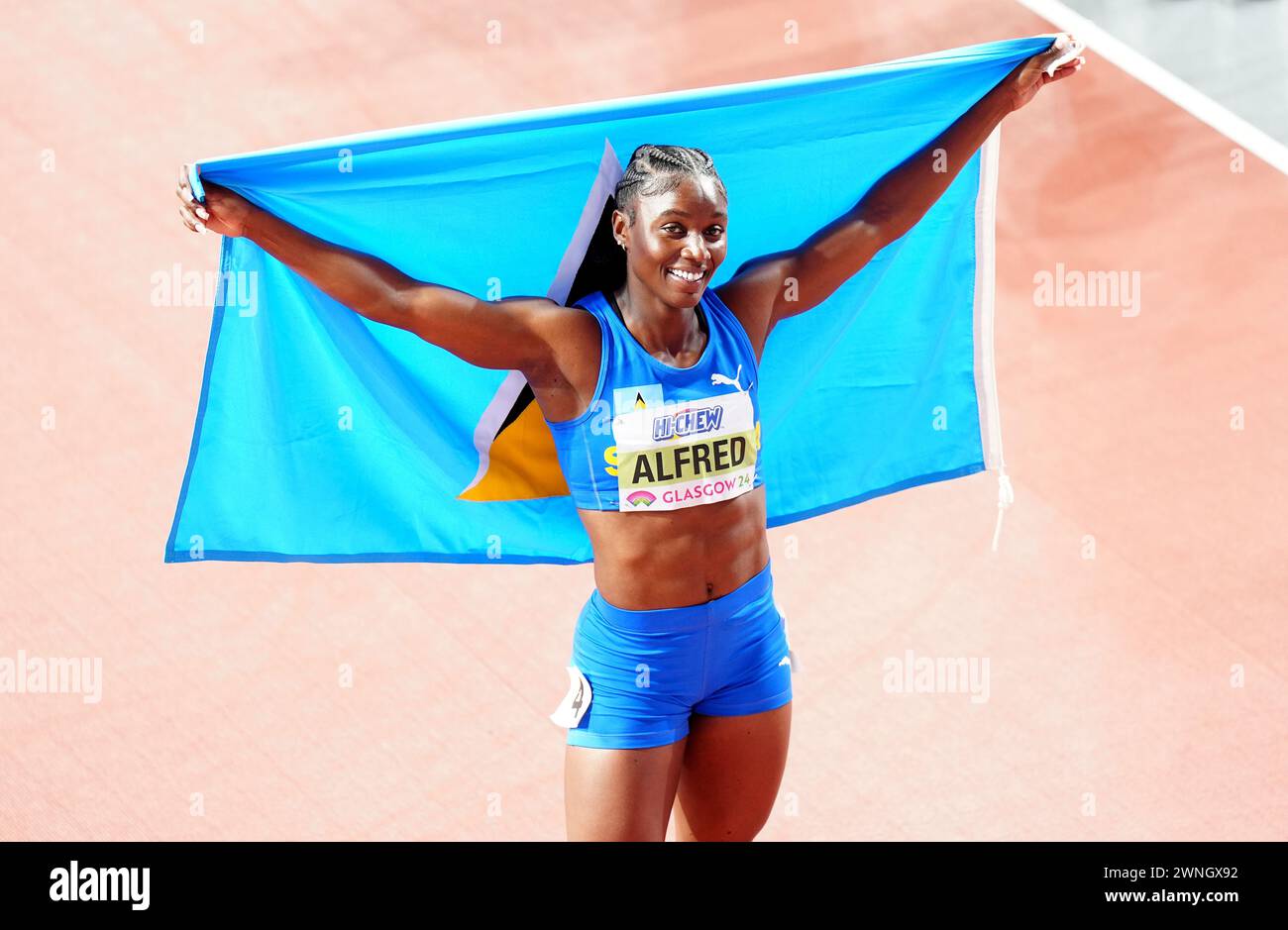 Saint Lucia's Julien Alfred celebrates winning the Women's 60m final