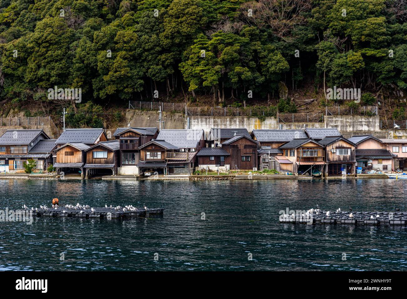 Traditional wooden fishermen Funaya boathouses in Ine north Kyoto prefecture on the Sea of Japan Stock Photo