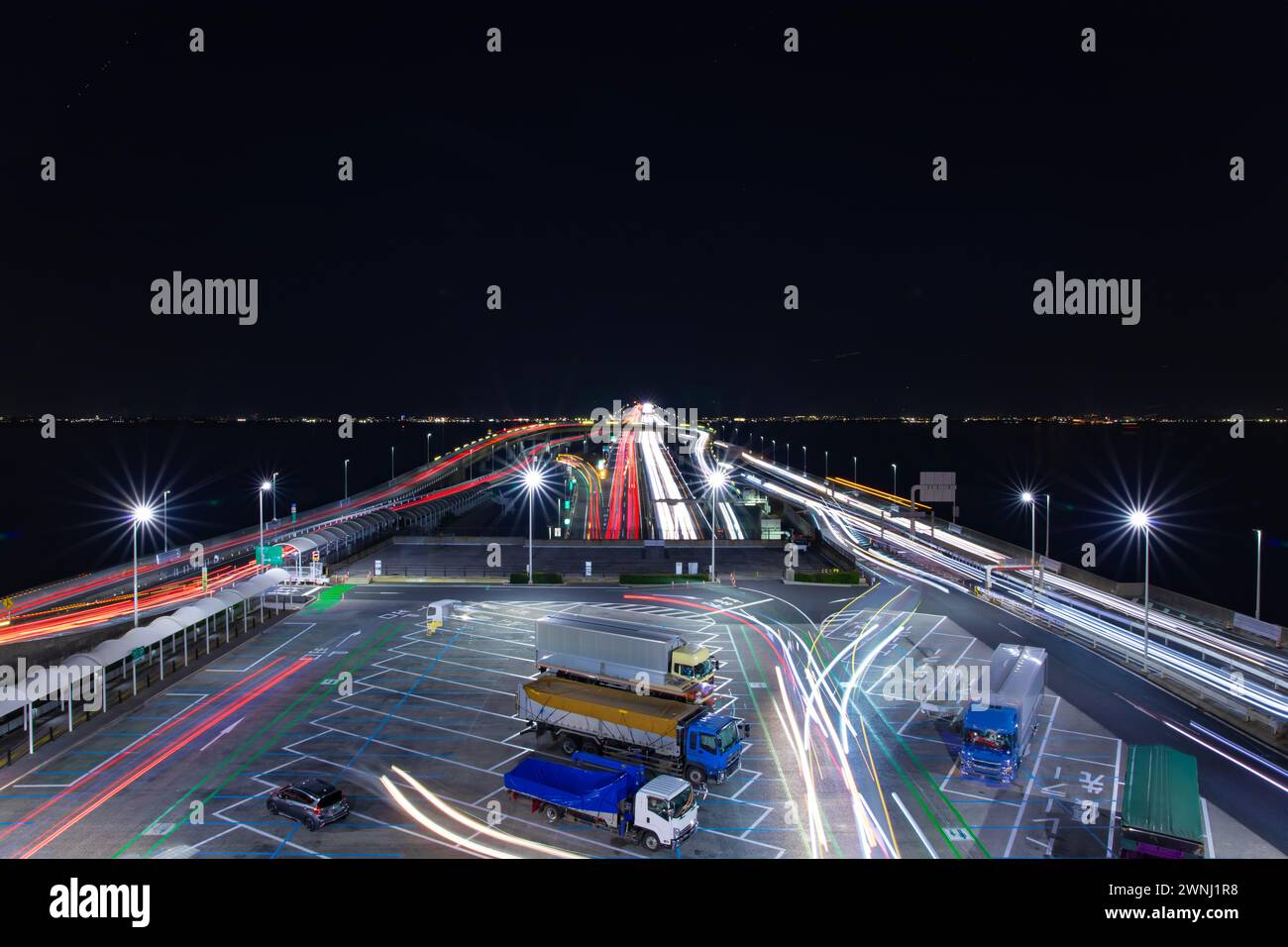 A night traffic jam on the highway at Tokyo bay area wide shot Stock Photo