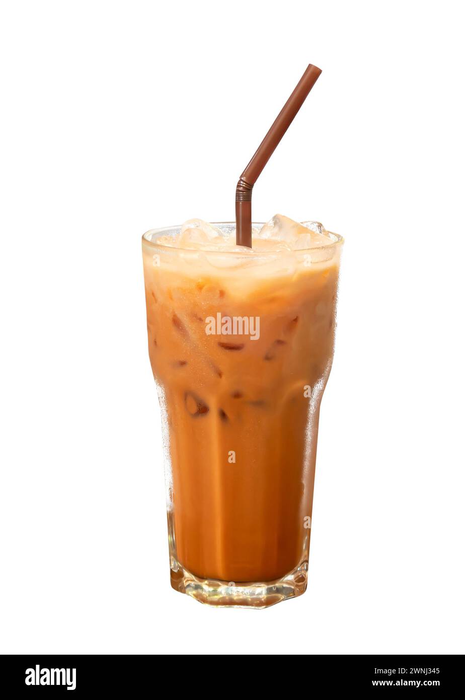 Front view of cold orange Thai tea with condensed milk and ice is isolated on white background with clipping path. Stock Photo
