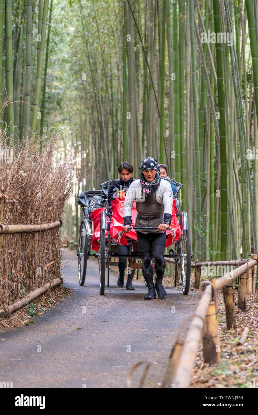 Arashiyama, Kyoto, Japan - Feb 24 2024 : Tourists enjoying the rickshaw ...
