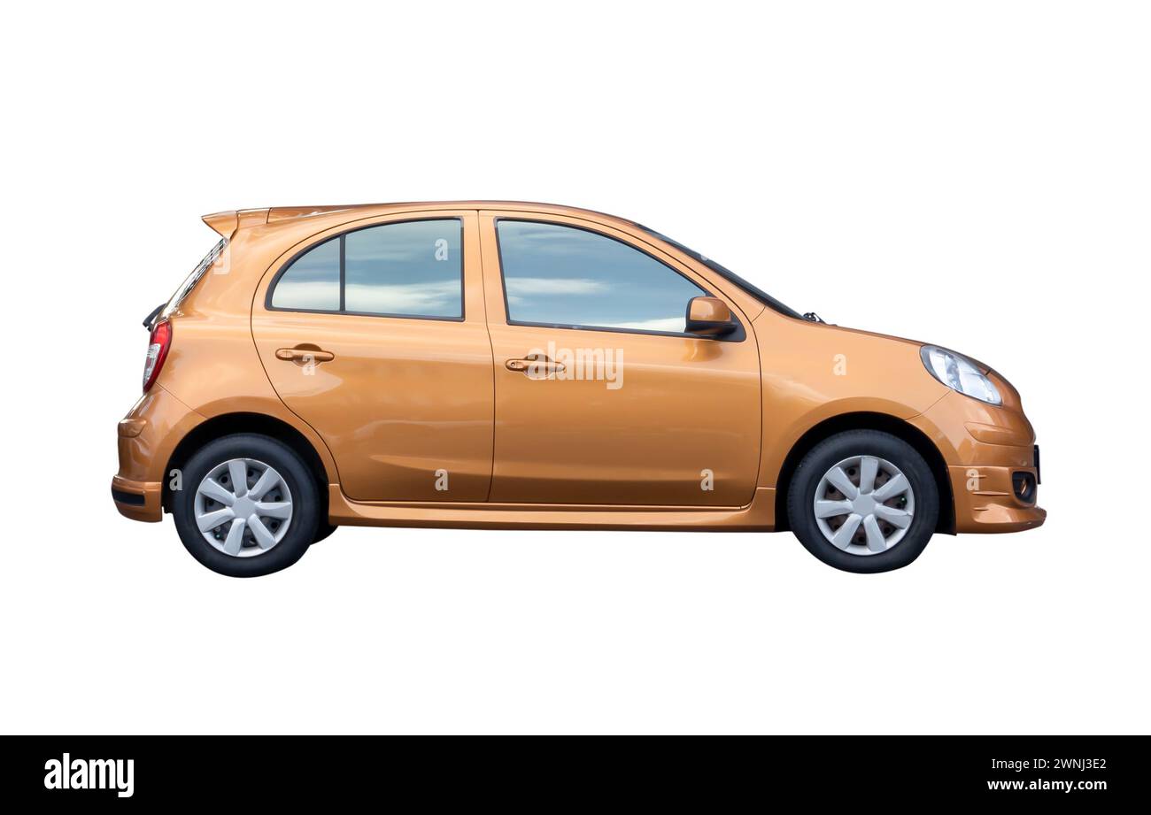 Side view of single lovely small orange car is isolated on white background with clipping path. Stock Photo