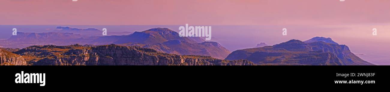 Mountains, landscape and pink sky with background for travel, hiking or eco friendly tourism and banner of Cape Town. Aerial view of sunset, nature Stock Photo