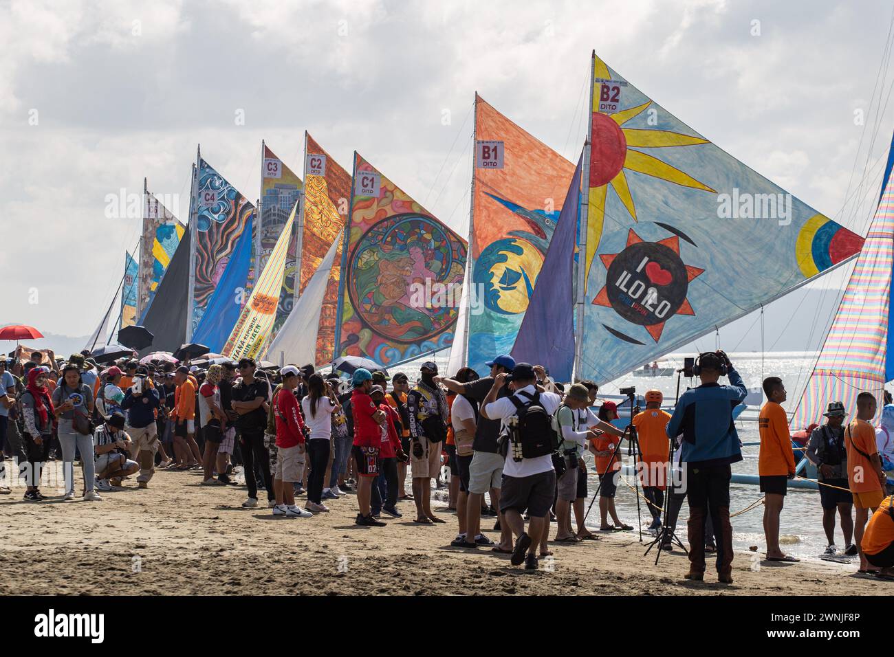 Iloilo, Philippines. 03rd Mar, 2024. People watch the sailboats from