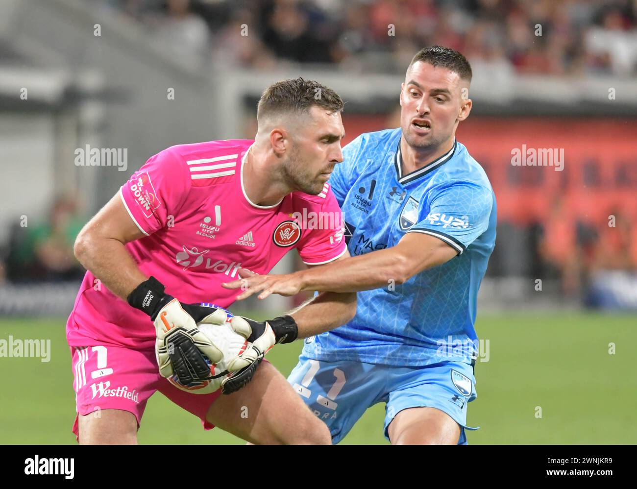 Sydney, Australia. 2nd Mar 2024 Sydney FC Robert Mak trying to get the ball from Wanderers keeper Daniel Margush during the Aleague Sydney Derby. Credit: Kleber Osorio/Alamy Live News Stock Photo