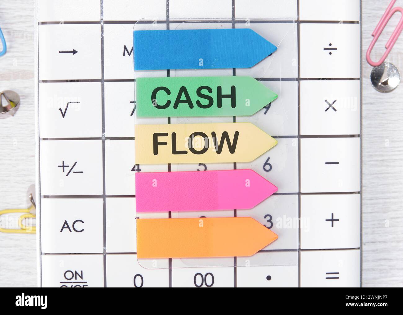 Cash flow text written on arrow-shaped stickers Stock Photo