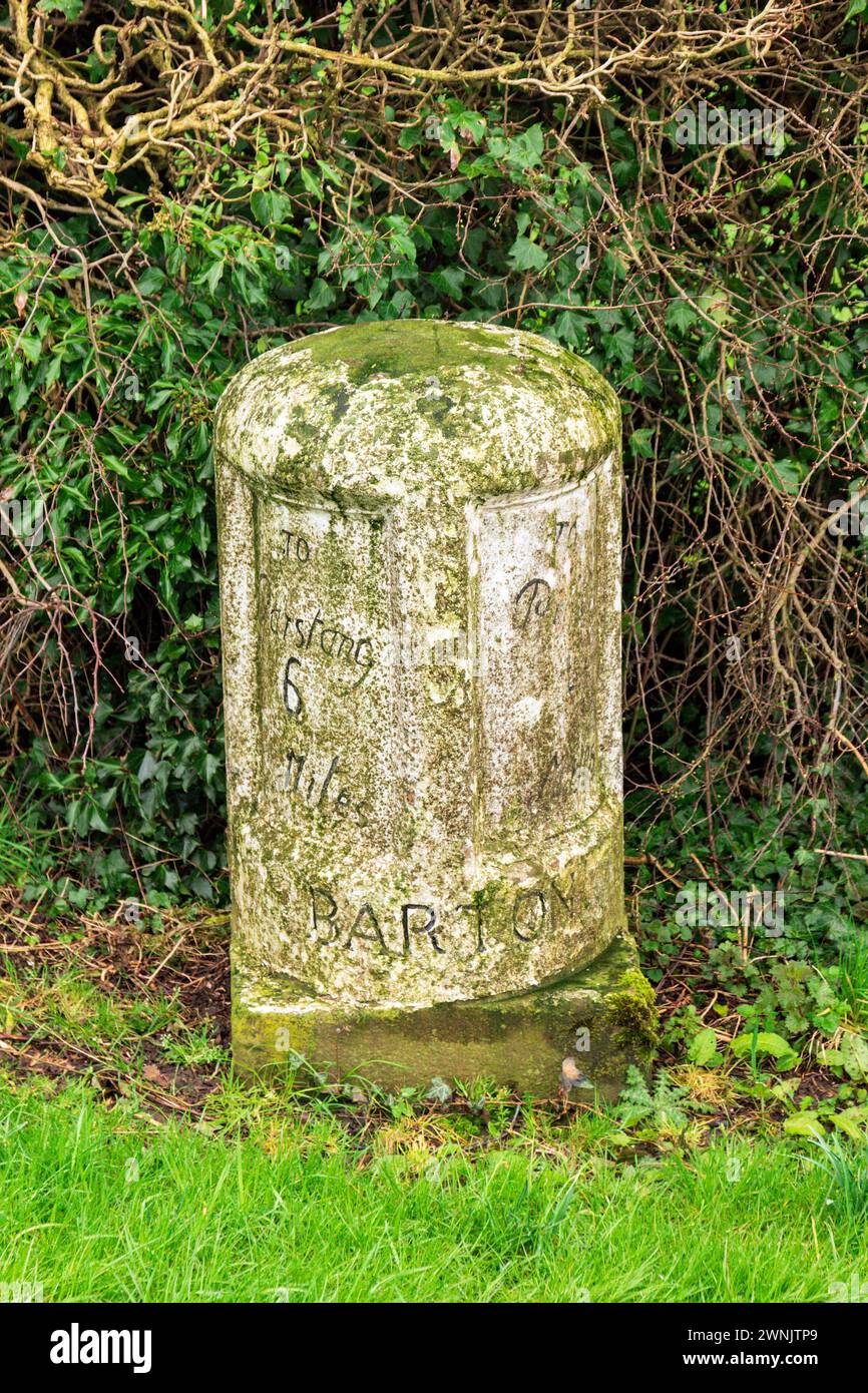 The third of nine milestones between Preston and Garstang, put in place by The Preston to Garstang Turnpike Trust. Situated at Broughton village. Stock Photo
